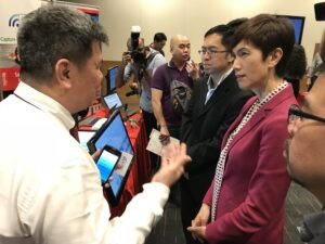 Attendees at the Security ITM Launch 2018 discussing transformation maps.