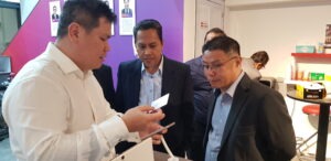 Government officials visiting a tech company’s office to learn about a new security system.